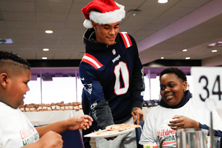 Christian Gonzalez, Hunter Henry, and Patriots teammates get in holiday spirit at community events