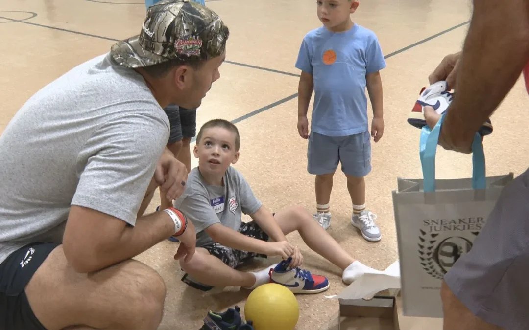New England Patriots’ Hunter Henry gifts new sneakers to dozens of foster youth